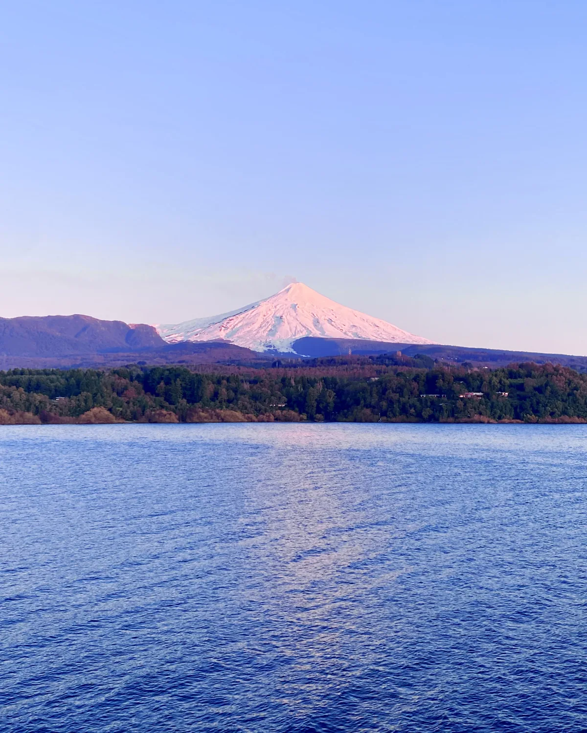 Villarrica at dusk across the lake